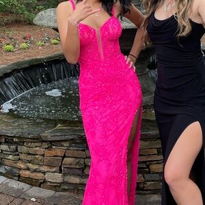 Long pink formal gown with bead detailing and slit